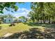 Large backyard with ample space for outdoor activities and mature trees for shade at 1225 W Smith St, Orlando, FL 32804
