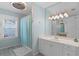 Bright bathroom with a shower-tub, vanity, and modern fixtures at 1225 W Smith St, Orlando, FL 32804