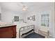 Cozy bedroom featuring a metal frame bed, ceiling fan, and natural lighting at 1225 W Smith St, Orlando, FL 32804