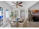 Inviting dining area with wicker chairs, glass table, and natural light from French doors at 1225 W Smith St, Orlando, FL 32804