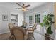 Cozy dining room with a glass table, wicker chairs, and access to a bright outdoor space through the French doors at 1225 W Smith St, Orlando, FL 32804