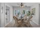 Bright dining area featuring a glass table, wicker chairs, and ample natural light from the French doors at 1225 W Smith St, Orlando, FL 32804