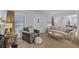 Bright living room featuring neutral walls, plush seating, and natural light from surrounding windows at 1225 W Smith St, Orlando, FL 32804