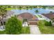 Desirable single-story home featuring a two-car garage, complemented by a serene lake in a residential community at 12845 Sawgrass Pine Cir, Orlando, FL 32824