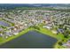 Community aerial view showcases a pool, a park, and lake views that enhance this home's neighborhood appeal at 12845 Sawgrass Pine Cir, Orlando, FL 32824
