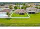 Home's backyard features a private fenced yard and partial lake views, perfect for outdoor activities at 12845 Sawgrass Pine Cir, Orlando, FL 32824