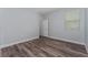Cozy bedroom features wood-look floors, neutral walls and a window with bright, natural light at 12845 Sawgrass Pine Cir, Orlando, FL 32824