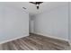 Bright bedroom with wood-look flooring and neutral paint provides a serene atmosphere at 12845 Sawgrass Pine Cir, Orlando, FL 32824