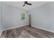Cozy bedroom with a ceiling fan and a bright window at 12845 Sawgrass Pine Cir, Orlando, FL 32824