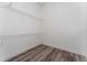 A closet provides ample storage with shelving, and modern wood-look floors at 12845 Sawgrass Pine Cir, Orlando, FL 32824