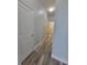 Hallway with updated flooring, new paint, and modern lighting at 12845 Sawgrass Pine Cir, Orlando, FL 32824