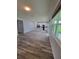 Bright open floor plan showcases modern kitchen with island, stainless appliances, and sleek cabinetry at 12845 Sawgrass Pine Cir, Orlando, FL 32824
