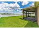 A home with a screened lanai providing a relaxing space overlooking the lush, green backyard at 12845 Sawgrass Pine Cir, Orlando, FL 32824