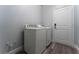 Convenient laundry area with a modern washer and dryer, as well as a utility closet at 12845 Sawgrass Pine Cir, Orlando, FL 32824