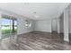 Bright living room with sliding doors to the outdoors and neutral paint at 12845 Sawgrass Pine Cir, Orlando, FL 32824