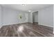 Comfortable living room with a window and neutral paint, featuring stylish wood flooring at 12845 Sawgrass Pine Cir, Orlando, FL 32824