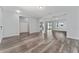 Spacious living room featuring stylish wood flooring and neutral paint tones at 12845 Sawgrass Pine Cir, Orlando, FL 32824