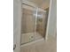Newly renovated shower with sleek glass door and stylish tile at 12845 Sawgrass Pine Cir, Orlando, FL 32824