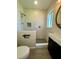 Updated bathroom featuring a walk-in shower with gray pebble floor and modern vanity at 1326 Edmundshire Ln, Orlando, FL 32806