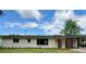 Charming single-story home featuring a covered front porch and fresh white paint at 1326 Edmundshire Ln, Orlando, FL 32806