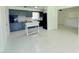 Open kitchen area with dark cabinets, an oven, and a tile floor at 1326 Edmundshire Ln, Orlando, FL 32806