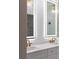 Elegant bathroom featuring double sink vanity with quartz countertop and illuminated mirror at 13393 Sw 484 Hwy, Ocala, FL 34481