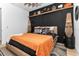 Modern bedroom with dark wood accents, a ceiling fan, and unique bedside lighting at 13393 Sw 484 Hwy, Ocala, FL 34481