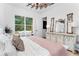 Comfortable bedroom featuring large window and stylish furnishings at 13393 Sw 484 Hwy, Ocala, FL 34481