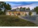 Charming single-story home with modern farmhouse design, inviting front porch, and meticulous landscaping at 13393 Sw 484 Hwy, Ocala, FL 34481