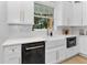 Beautiful kitchen with white cabinets, stainless steel appliances, and farmhouse sink at 13393 Sw 484 Hwy, Ocala, FL 34481