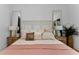 A cozy main bedroom featuring stylish décor, soft lighting, and a peaceful ambiance at 13393 Sw 484 Hwy, Ocala, FL 34481