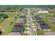 Aerial view of homes and community amenities, including pool and amenity center at 1396 Mirabella Cir, Davenport, FL 33897