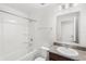 Clean, bright bathroom with shower, tub, and granite countertop vanity at 1396 Mirabella Cir, Davenport, FL 33897
