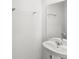 Bright half-bathroom features a pedestal sink and a towel rack at 1396 Mirabella Cir, Davenport, FL 33897