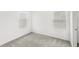 Well-lit bedroom with neutral carpet and bright white walls at 1396 Mirabella Cir, Davenport, FL 33897