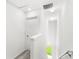 Hallway with carpeted stairs and a view of the yard through a window at the base of the stairs at 1396 Mirabella Cir, Davenport, FL 33897
