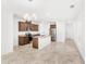Open-concept living space with tile flooring flowing into a kitchen featuring a central island at 1396 Mirabella Cir, Davenport, FL 33897
