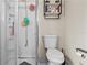 Compact bathroom featuring a standard toilet and shower at 14 Sequoia Way, Kissimmee, FL 34758