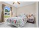 Bright bedroom with large window and tile flooring at 14 Sequoia Way, Kissimmee, FL 34758