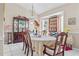 Cozy dining room with traditional furnishings, including a china cabinet and chandelier at 14 Sequoia Way, Kissimmee, FL 34758