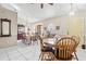 Spacious dining area with a blend of classic and modern decor, enhanced by natural light at 14 Sequoia Way, Kissimmee, FL 34758
