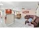 Open-concept living area with a spacious layout and natural light and tile flooring throughout at 14 Sequoia Way, Kissimmee, FL 34758