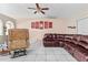 Bright living area featuring tile floors, ample seating, and a comfortable atmosphere at 14 Sequoia Way, Kissimmee, FL 34758