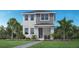 Beautiful two-story home with a landscaped yard, gray siding and stucco exterior at 1438 Ridgeback Ln, Apopka, FL 32703