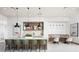Bright kitchen boasts a large island with seating and stylish modern finishes at 1438 Ridgeback Ln, Apopka, FL 32703