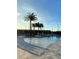 Resort-style pool area with lounge chairs, umbrellas, and tropical landscaping at 1438 Ridgeback Ln, Apopka, FL 32703