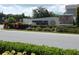 Community sign for Winding Bay Preserve featuring lush landscaping and stacked stone accents at 14955 Lebeau Loop, Winter Garden, FL 34787