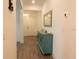 Inviting entryway showcasing wood-look floors, a stylish accent table, and a mirror that brightens the space at 14955 Lebeau Loop, Winter Garden, FL 34787
