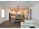 Open-concept living space with a dining area and kitchen, perfect for entertaining and Gathering gatherings at 14955 Lebeau Loop, Winter Garden, FL 34787