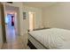 Bright bedroom view including doorway and a closet at 1504 Virginia Ave # 105, Daytona Beach, FL 32114